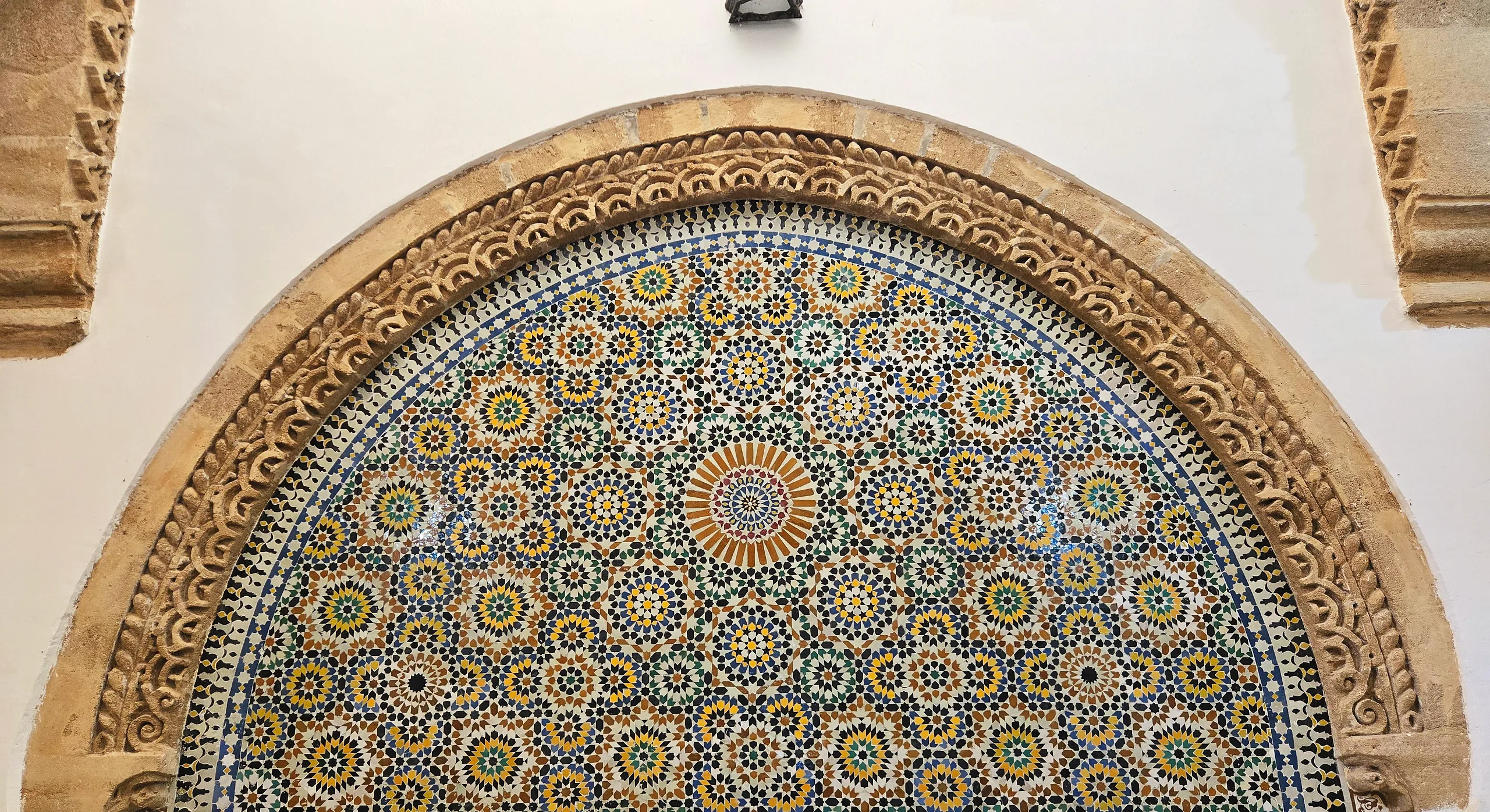 The domed, tiled interior of the Hammam Saffarin in Fes